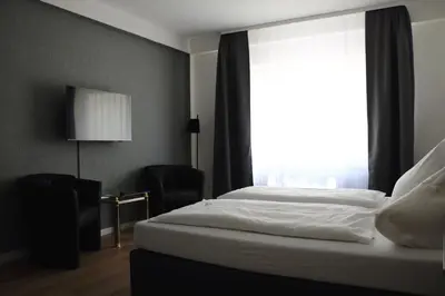 Ein Bett oder Betten in einem Zimmer der Unterkunft Hotel St. Georg