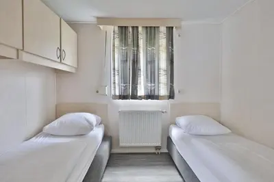 Ein Bett oder Betten in einem Zimmer der Unterkunft M13 Hotel