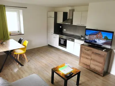 Küche/Küchenzeile in der Unterkunft Pitlane Apartments am Brünnchen