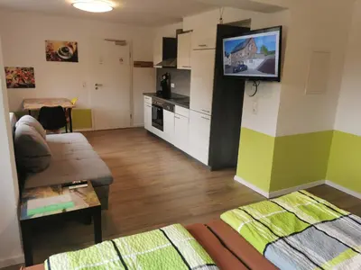 TV/Unterhaltungsangebot in der Unterkunft Pitlane Apartments am Brünnchen