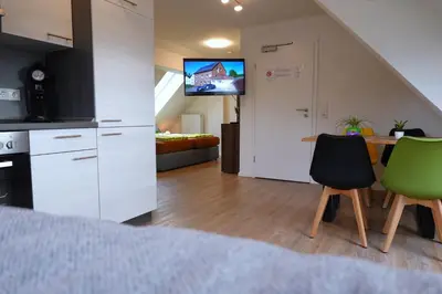 Küche/Küchenzeile in der Unterkunft Pitlane Apartments am Brünnchen