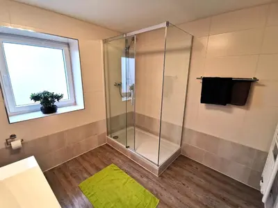 Ein Badezimmer in der Unterkunft Pitlane Apartments am Brünnchen