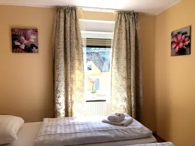 Ein Bett oder Betten in einem Zimmer der Unterkunft MaximilianHaus