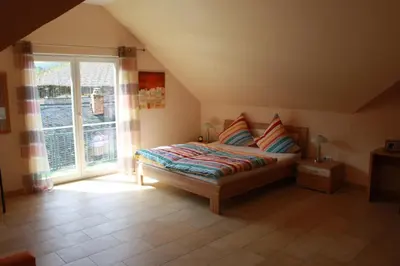 Ein Bett oder Betten in einem Zimmer der Unterkunft Ferienhaus Trimmisch