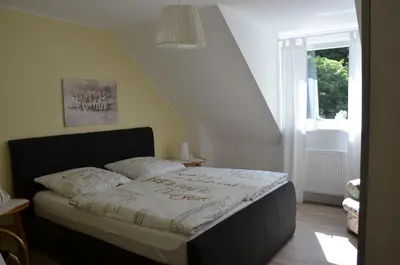 Ein Bett oder Betten in einem Zimmer der Unterkunft Moni's Ferienwohnung