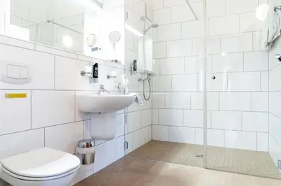Ein Badezimmer in der Unterkunft Land-gut-Hotel am Ring