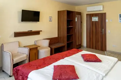 Ein Bett oder Betten in einem Zimmer der Unterkunft Land-gut-Hotel am Ring
