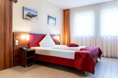 Ein Bett oder Betten in einem Zimmer der Unterkunft Land-gut-Hotel am Ring