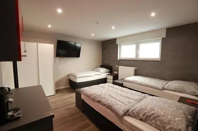 Ein Bett oder Betten in einem Zimmer der Unterkunft Guesthouse Cockpit