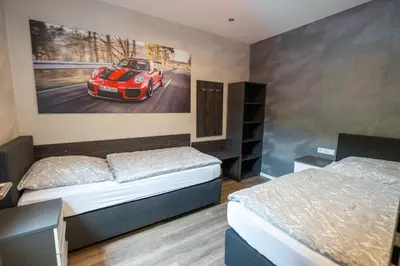 Ein Bett oder Betten in einem Zimmer der Unterkunft Guesthouse Cockpit