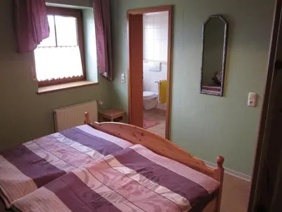 Ein Bett oder Betten in einem Zimmer der Unterkunft Gästehaus Jüngling