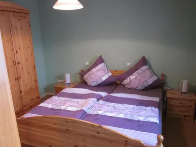 Ein Bett oder Betten in einem Zimmer der Unterkunft Gästehaus Jüngling