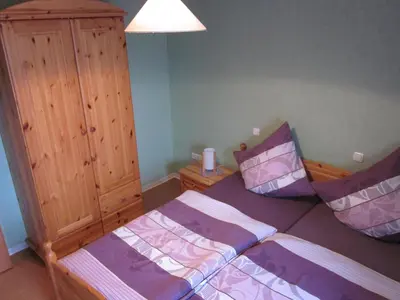 Ein Bett oder Betten in einem Zimmer der Unterkunft Gästehaus Jüngling