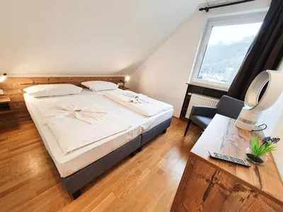 Ein Bett oder Betten in einem Zimmer der Unterkunft Winzerhaus Gärtner - An der Loreley