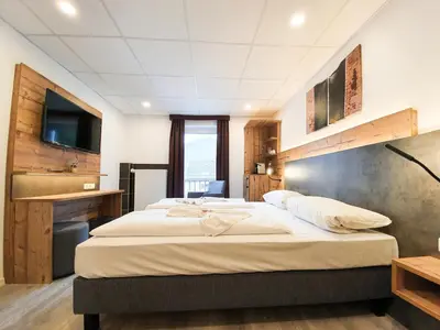 Ein Bett oder Betten in einem Zimmer der Unterkunft Winzerhaus Gärtner - An der Loreley