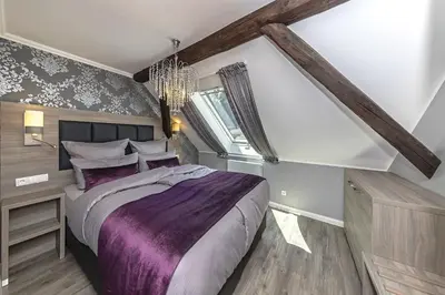 Ein Bett oder Betten in einem Zimmer der Unterkunft Apartmenthaus Burgenheimat in Rhens bei Koblenz