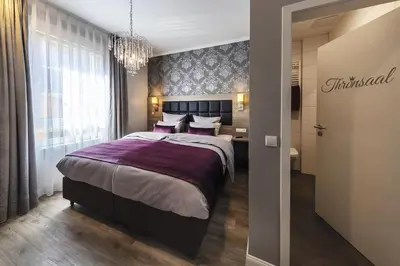 Ein Bett oder Betten in einem Zimmer der Unterkunft Apartmenthaus Burgenheimat in Rhens bei Koblenz