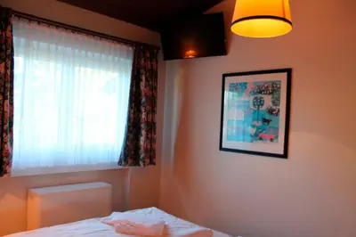Ein Bett oder Betten in einem Zimmer der Unterkunft Landhaus Seeblick