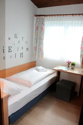 Ein Bett oder Betten in einem Zimmer der Unterkunft Landhaus Seeblick