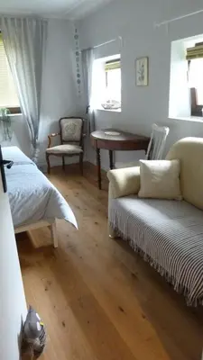 Ein Sitzbereich in der Unterkunft Gästezimmer Am Hüstert