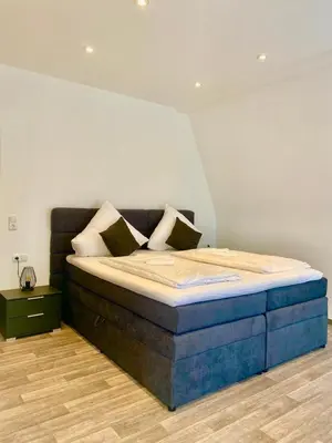 Ein Bett oder Betten in einem Zimmer der Unterkunft Hotel Krone Riesling