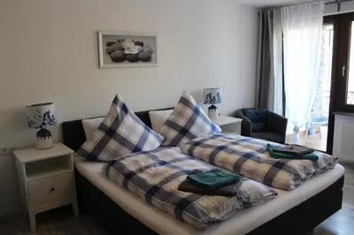 Ein Bett oder Betten in einem Zimmer der Unterkunft Haus Mühlenruh