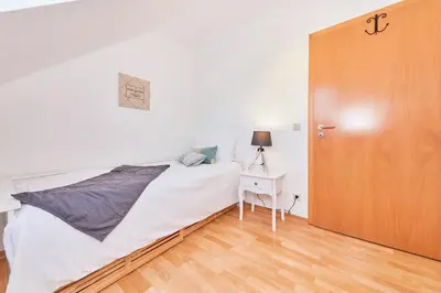 Ein Bett oder Betten in einem Zimmer der Unterkunft Moselschleife