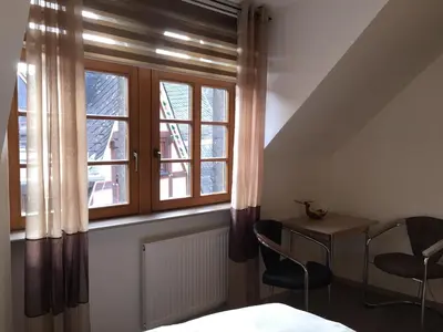 Ein Bett oder Betten in einem Zimmer der Unterkunft Hotel Zur Dorfschänke