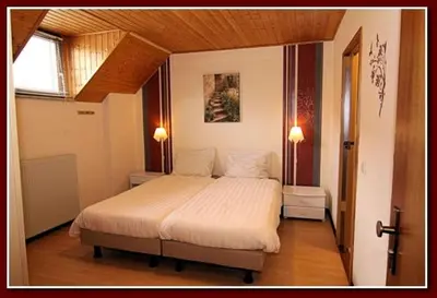 Ein Bett oder Betten in einem Zimmer der Unterkunft Hotel Zur Dorfschänke