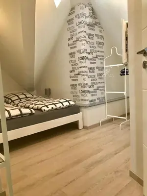 Ein Bett oder Betten in einem Zimmer der Unterkunft Ferienwohnung auf der Moselhöhe - Nähe Koblenz und Cochem