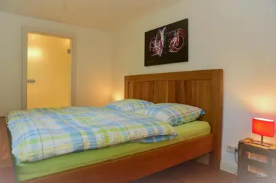 Ein Bett oder Betten in einem Zimmer der Unterkunft FeWo Freis in Brauneberg