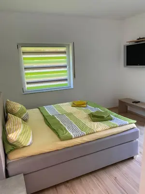 Ein Bett oder Betten in einem Zimmer der Unterkunft Ferienhaus Mausberg
