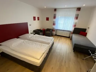 Ein Bett oder Betten in einem Zimmer der Unterkunft Hotel Rebstock