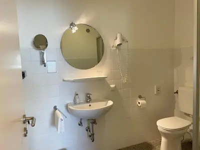 Ein Badezimmer in der Unterkunft Hotel-Pension Hommen