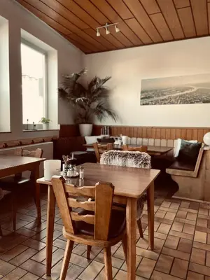 Ein Sitzbereich in der Unterkunft Hotel-Pension Hommen