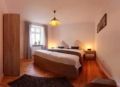 Ein Bett oder Betten in einem Zimmer der Unterkunft Altes Lörscher Winzerhaus