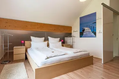 Ein Bett oder Betten in einem Zimmer der Unterkunft Eifel-Apartments Orsfeld - Apartments mit Tieren & Natur
