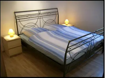 Ein Bett oder Betten in einem Zimmer der Unterkunft Ferienhaus Burgeiche
