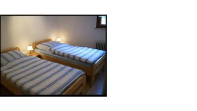 Ein Bett oder Betten in einem Zimmer der Unterkunft Ferienhaus Burgeiche