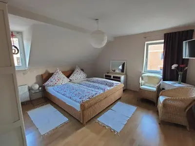 Ein Bett oder Betten in einem Zimmer der Unterkunft Gästehaus Voyage