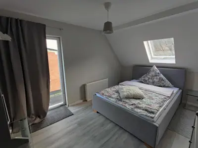 Ein Bett oder Betten in einem Zimmer der Unterkunft Gästehaus Voyage