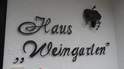Ein Zertifikat, Auszeichnung, Logo oder anderes Dokument, das in der Unterkunft Haus Weingarten APPARTEMENTS-ZIMMER ausgestellt ist