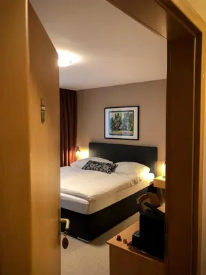 Ein Bett oder Betten in einem Zimmer der Unterkunft Hotel Restaurant Denis