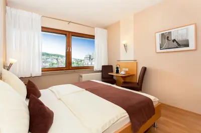 Ein Bett oder Betten in einem Zimmer der Unterkunft Moselhaus Weiskopf `SelfCheckIn`OffSiteBreakfast`CityParking`