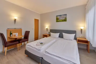 Ein Bett oder Betten in einem Zimmer der Unterkunft Moselhaus Weiskopf `SelfCheckIn`OffSiteBreakfast`CityParking`