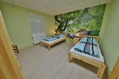 Ein Bett oder Betten in einem Zimmer der Unterkunft Barrierefreie 6 Personen Ferienwohnung im Landhausstil