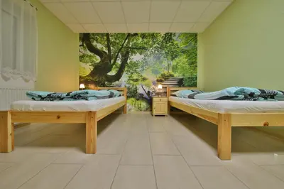 Ein Bett oder Betten in einem Zimmer der Unterkunft Barrierefreie 6 Personen Ferienwohnung im Landhausstil