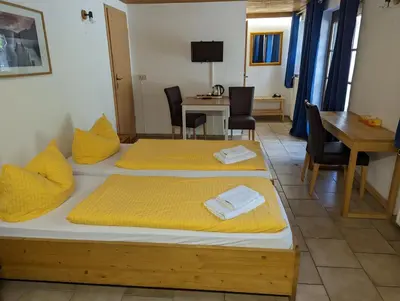 Ein Bett oder Betten in einem Zimmer der Unterkunft Hotel Pension Winzerhaus