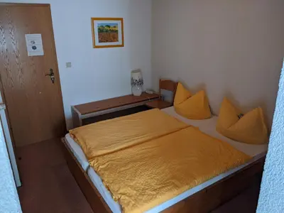 Ein Bett oder Betten in einem Zimmer der Unterkunft Hotel Pension Winzerhaus