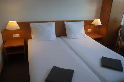 Ein Bett oder Betten in einem Zimmer der Unterkunft Niedereher Mühle